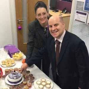 Ben Lee and Stacey Cole cut the cake for the Bristol branch