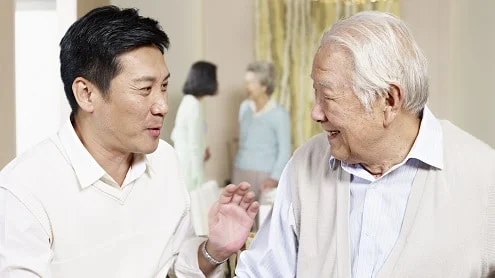 Elderly father and adult son