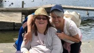 Helen and her carer on holiday