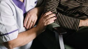 Audrey receives support from a care assistant