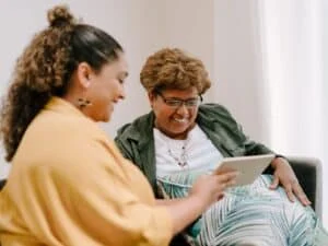 women showing women tablet screen