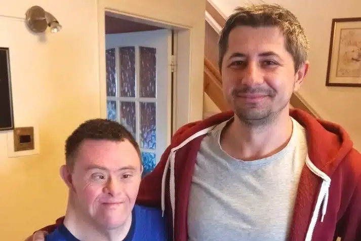 customer martin downs syndrome carer red hoodie 3x2.