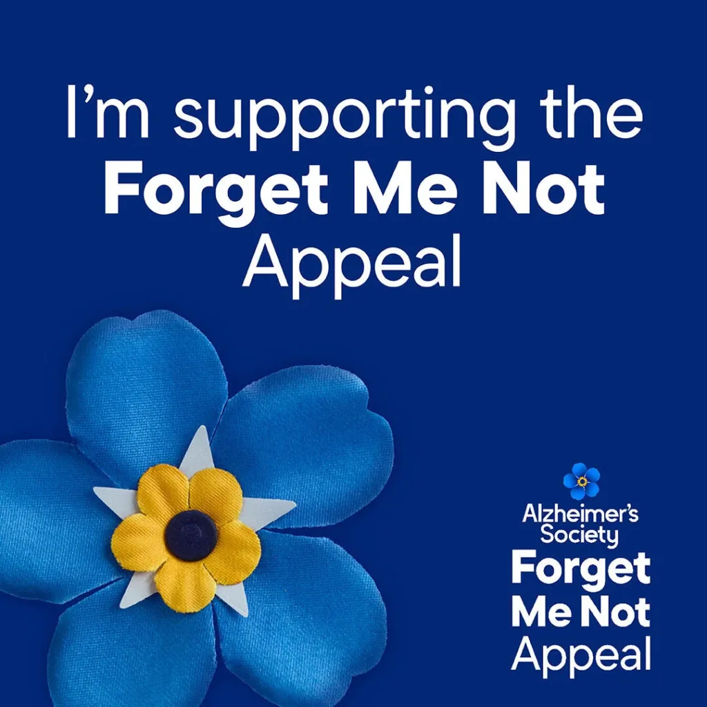 A blue forget-me-not flower with a yellow centre sits beside text reading I’m supporting the Forget Me Not Appeal. A small key appears alongside the Alzheimer’s Society Forget Me Not Appeal logo at the bottom right.