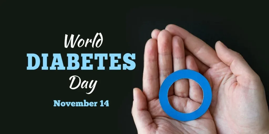 Hands cupping a blue circle, representing the World Diabetes Day symbol, with text reading World Diabetes Day, 14 November.