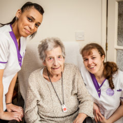 A customer with two visiting carers