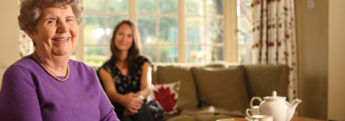 An elderly lady at home with her live-in carer