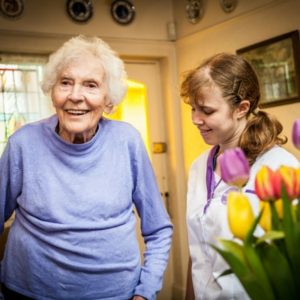 An elderly lady with her visiting carer