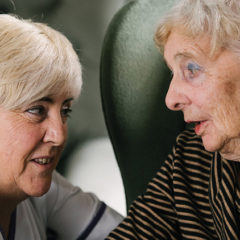 Audrey speaking with a care assistant