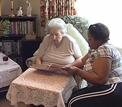 An elderly lady with her live-in carer - dementia care at home