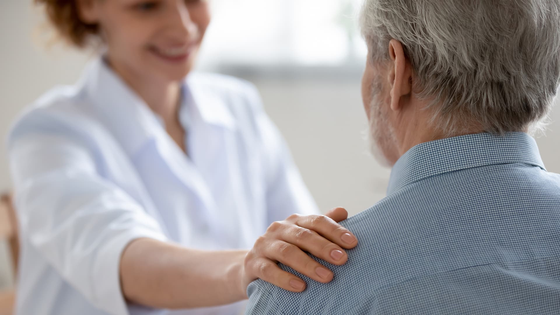 Nurse putting hand on shoulder