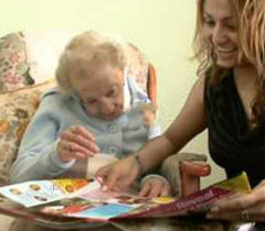 An elderly lady with her carer